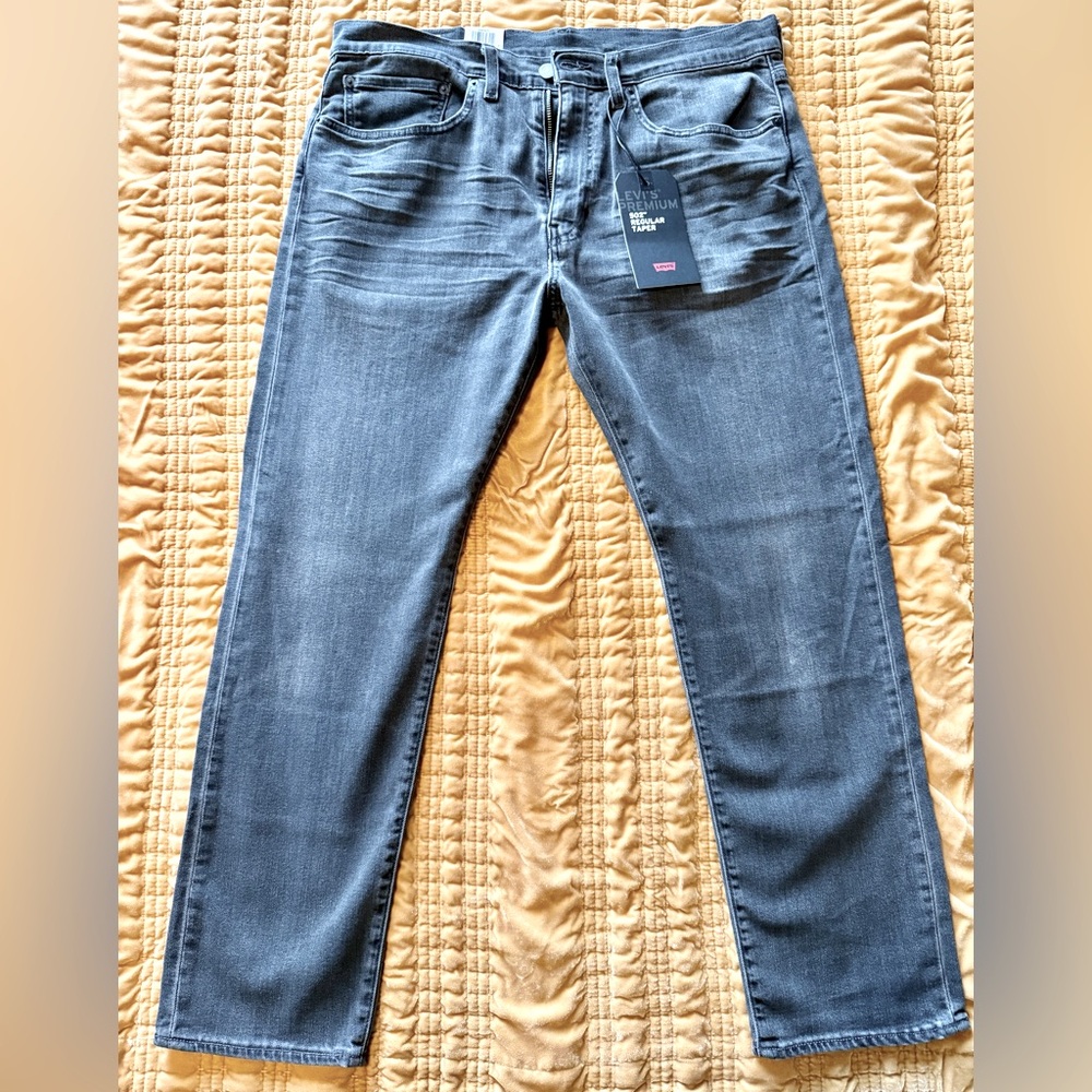 Brand new, with tags never worn 502 Levi’s. These are dark grey, straight leg.